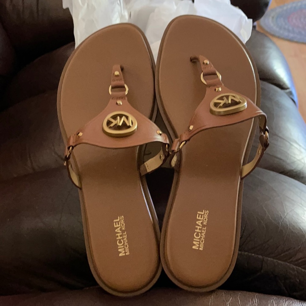 A brand new pair of Michael Kors sandals